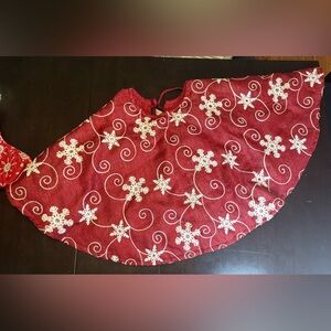 Red and White tree skirt, with Snowflake Design. Like new